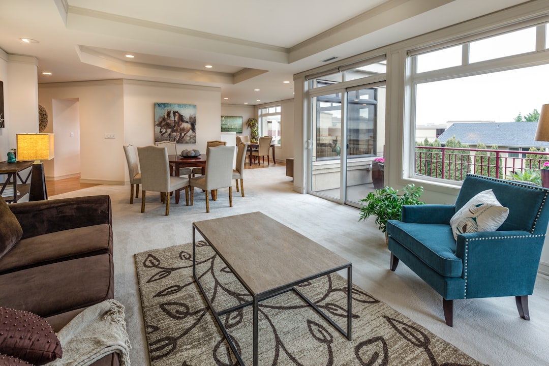The bright and airy interior of a professionally staged modern living room, showcasing the quality marketing a full-service real estate agent provides.